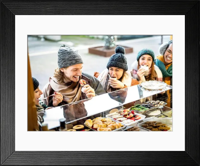 Framed Print : Happy friends having fun eating at Christmas market on winter time - Urban holiday concept with young people hanging Framed Print : Happy friends having fun eating at Christmas market on winter time - Urban holiday concept with young people hanging