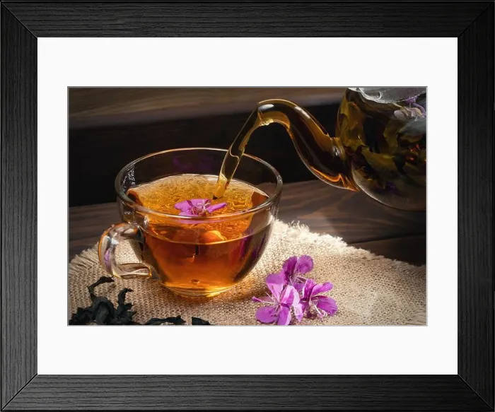 Framed Print : Pouring fireweed herbal tea into a transparent cup Framed Print : Pouring fireweed herbal tea into a transparent cup
