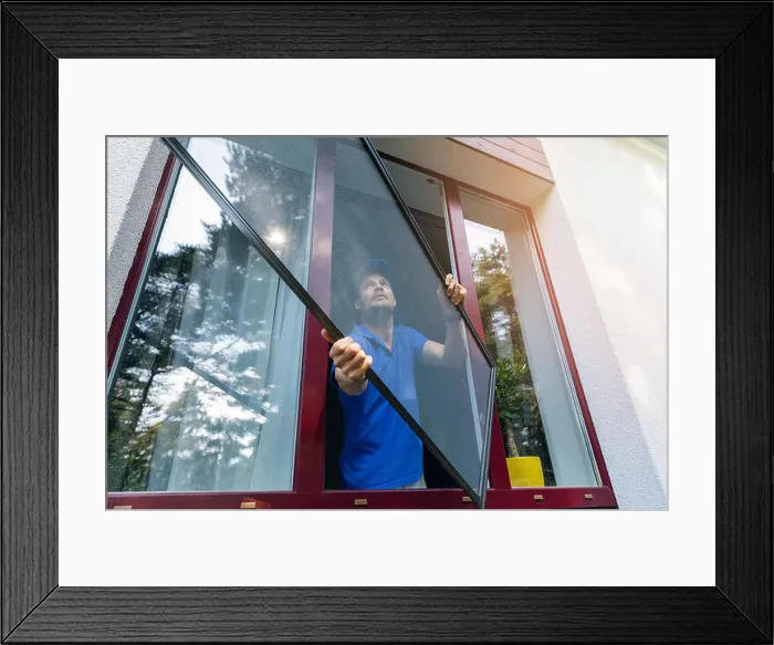 Framed Print : worker installing mosquito net wire screen on plastic pvc window Framed Print : worker installing mosquito net wire screen on plastic pvc window