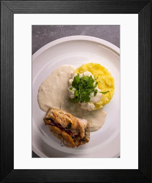 Framed Print : turkey roll filled with spinach and ham served with mashed potatoes and cream sauce