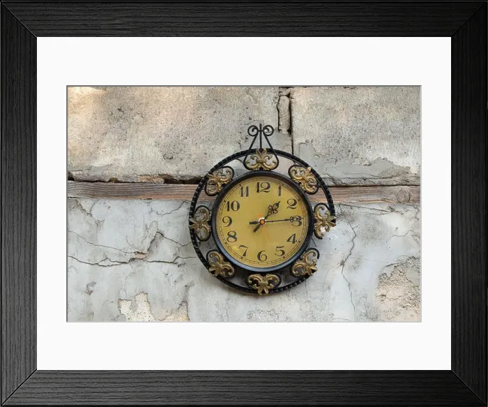 Framed Print : old broken clock ussr hangs on the white wall of a house in the street in the sun, broken old wall clock