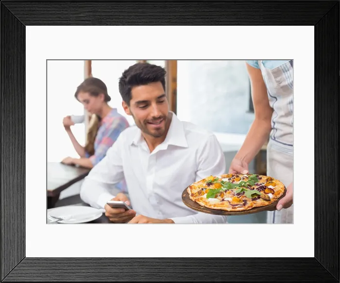 Framed Print : Waitress giving pizza to man at coffee shop Framed Print : Waitress giving pizza to man at coffee shop