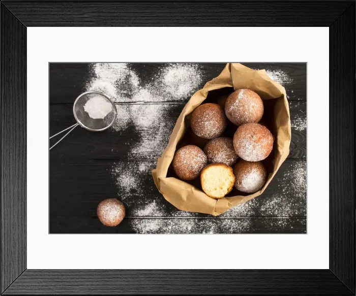 Framed Print : Homemade cottage cheese donuts in the paper package on the black wooden background. Top view. Closeup Framed Print : Homemade cottage cheese donuts in the paper package on the black wooden background. Top view. Closeup