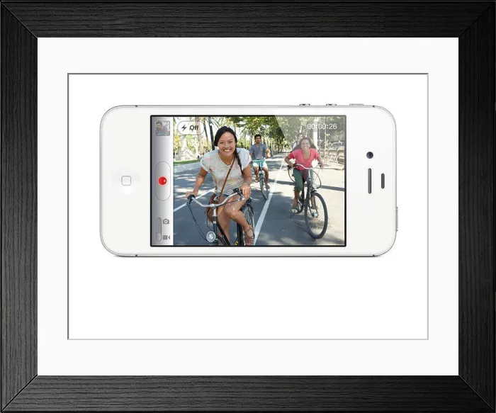 Framed Print : A handout file of Apple dated 04 October 2011 shows the new model of iPhone - the 4S- in Cupertino
