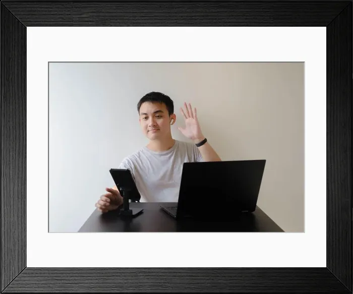 Framed Print : A young Asian man wearing a grey t-shirt Framed Print : A young Asian man wearing a grey t-shirt