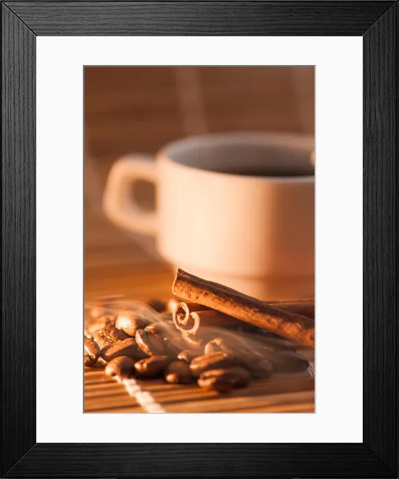 Framed Print : flat angled view of a white Cup on bamboo mat with previous coffee beans and cinnamon on it Framed Print : flat angled view of a white Cup on bamboo mat with previous coffee beans and cinnamon on it