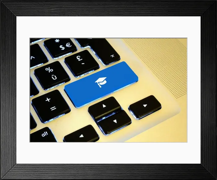 Framed Print : lose up on a blue key with a white graduation cap on it Framed Print : lose up on a blue key with a white graduation cap on it