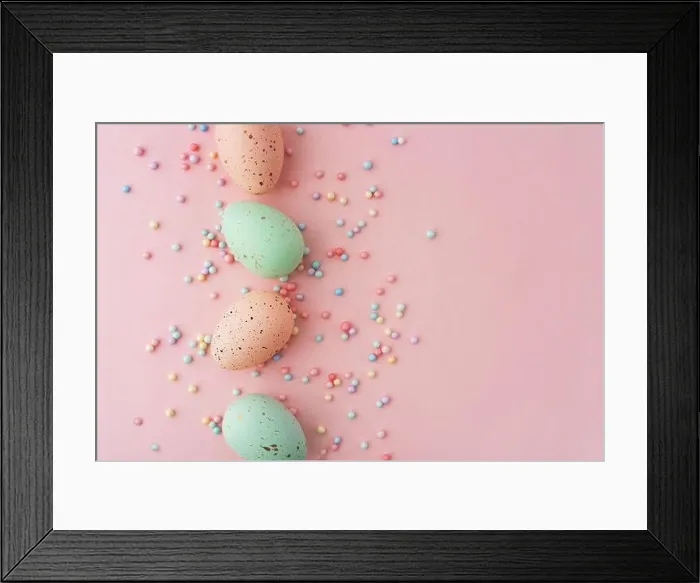 Framed Print : Four Easter eggs in pastel pink and green colors are artistically placed on a pink surface Framed Print : Four Easter eggs in pastel pink and green colors are artistically placed on a pink surface