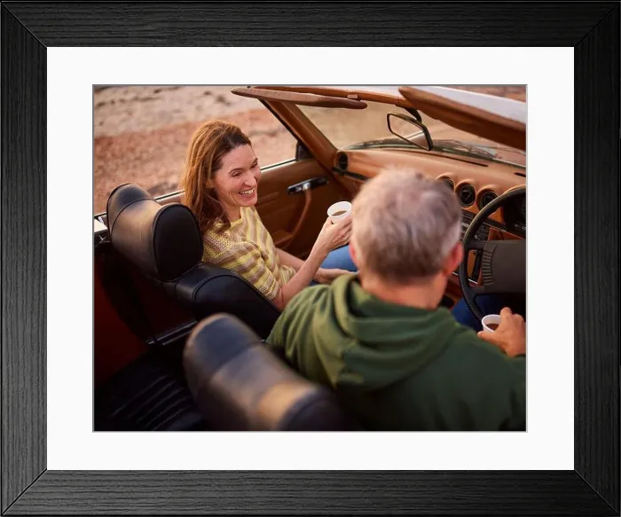 Framed Print : Retired Senior Couple In Classic Sports Car With Hot Drink At Beach Watching Sunrise Framed Print : Retired Senior Couple In Classic Sports Car With Hot Drink At Beach Watching Sunrise