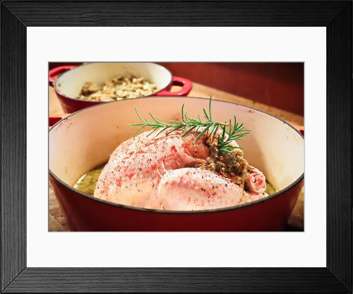 Framed Print : Side view of a raw chicken with stuffing in a pot Framed Print : Side view of a raw chicken with stuffing in a pot