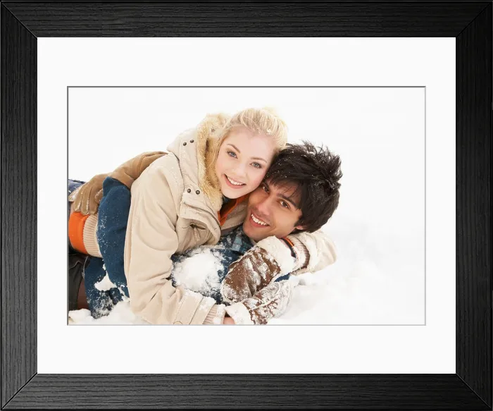 Framed Print : Romantic Teenage Couple Having Fun In Snow Framed Print : Romantic Teenage Couple Having Fun In Snow