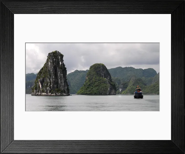 Framed Print : Cruise tourist boats at Halong bay famous resort in Halong city, Vietnam. Halong bay is made of 3000 limestone islands Framed Print : Cruise tourist boats at Halong bay famous resort in Halong city, Vietnam. Halong bay is made of 3000 limestone islands