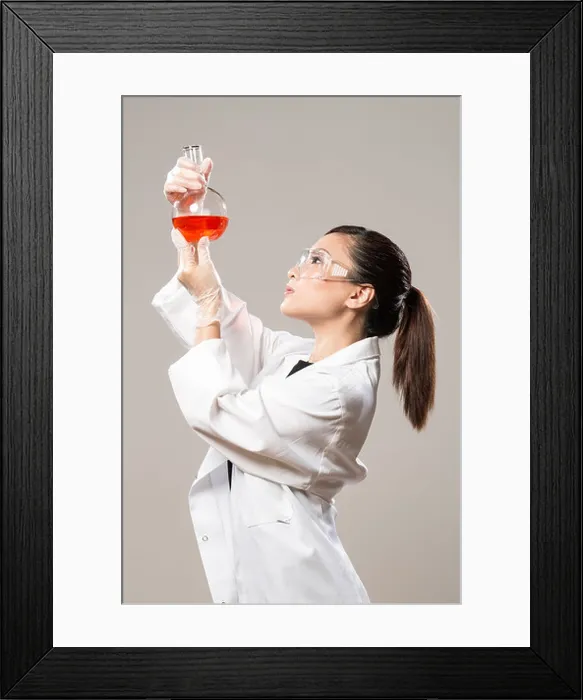Framed Print : Female Chinese Healthcare professional or scientific researcher looking at a row of test tubes Framed Print : Female Chinese Healthcare professional or scientific researcher looking at a row of test tubes