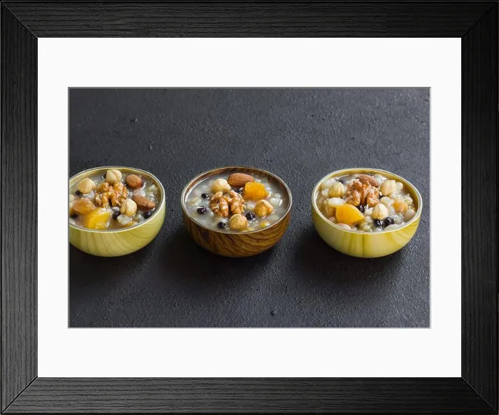 Framed Print : Traditional Turkish Dessert Ashure or Noah Puding, designed in bamboo bowls on black surface Framed Print : Traditional Turkish Dessert Ashure or Noah Puding, designed in bamboo bowls on black surface