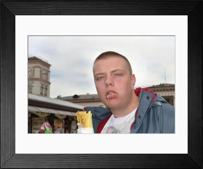 Framed Print : Portrait of a funny guy who eats shawarma with great pleasure Framed Print : Portrait of a funny guy who eats shawarma with great pleasure