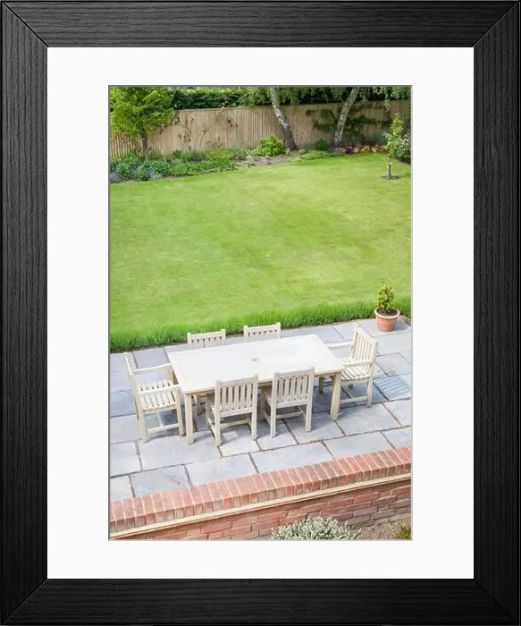 Framed Print : Large back garden in UK in summer, with wooden furniture on a garden patio terrace Framed Print : Large back garden in UK in summer, with wooden furniture on a garden patio terrace
