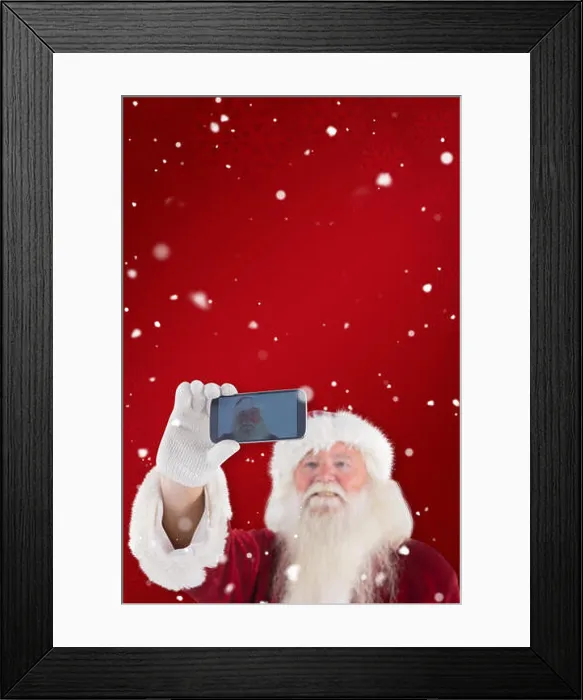 Framed Print : Composite image of santa taking a selfie on phone Framed Print : Composite image of santa taking a selfie on phone