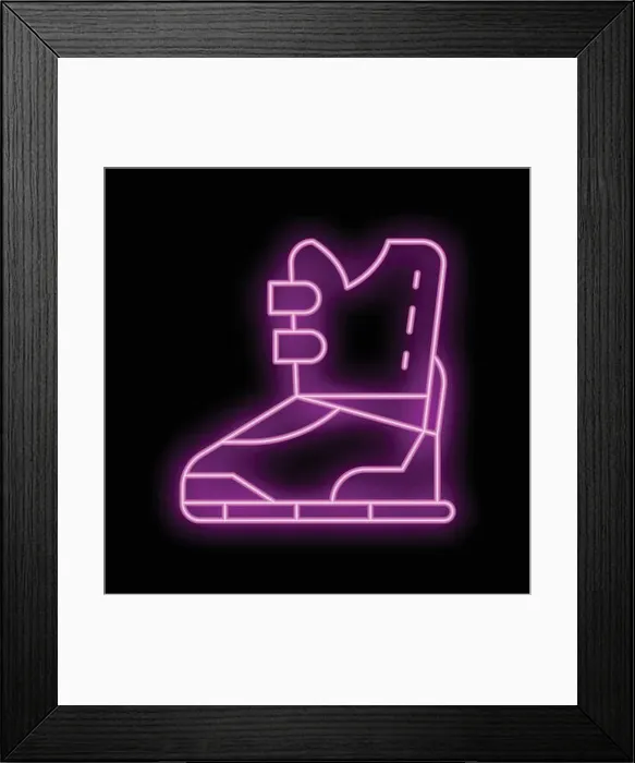 Framed Print : Neon sign showing a hiking boot, glowing pink against a black background Framed Print : Neon sign showing a hiking boot, glowing pink against a black background
