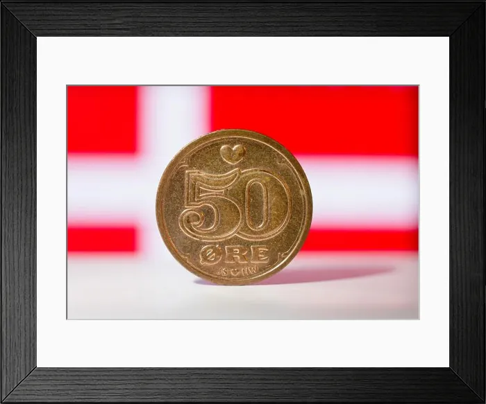 Framed Print : Danish 50 ore with a Danish flag behind in a background - macro shallow focus Framed Print : Danish 50 ore with a Danish flag behind in a background - macro shallow focus