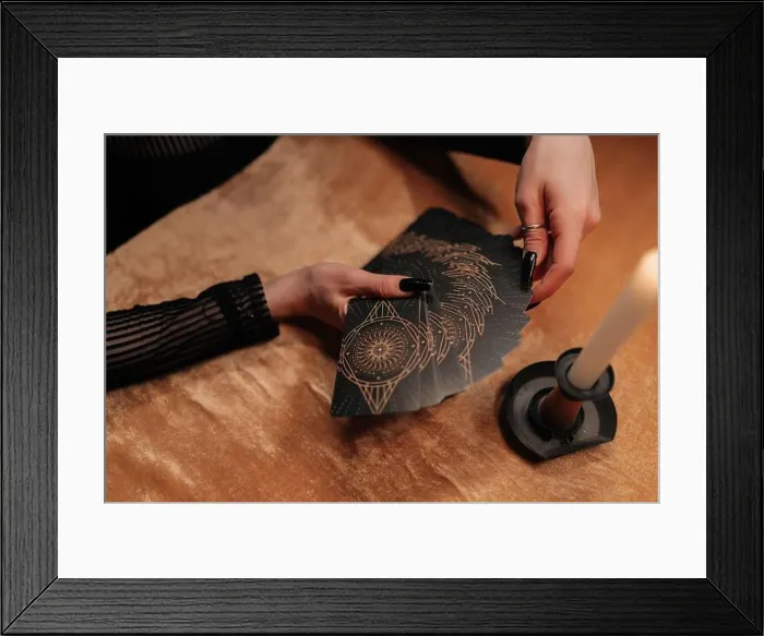 Framed Print : Top view cropped shot of unrecognizable otherworldly fortuneteller shuffling deck of tarot cards by light of burning Framed Print : Top view cropped shot of unrecognizable otherworldly fortuneteller shuffling deck of tarot cards by light of burning