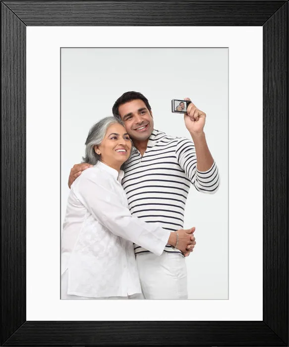 Framed Print : Man with his mother taking picture of themselves with a digital camera Framed Print : Man with his mother taking picture of themselves with a digital camera