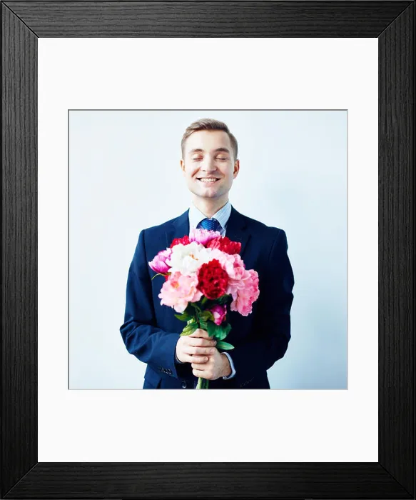 Framed Print : Happy young man holding bunch of fresh peonies Framed Print : Happy young man holding bunch of fresh peonies