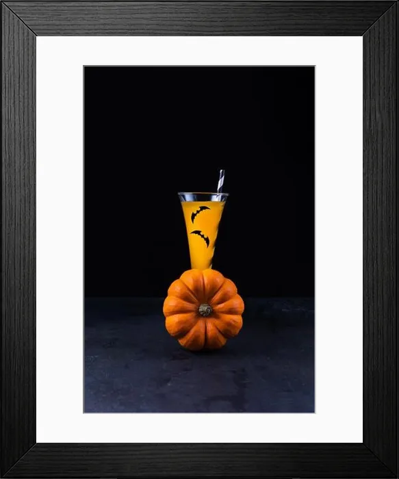 Framed Print : Orange pumpkin and pumpkin non-alcoholic mocktail in tall glass decorated with paper bats Framed Print : Orange pumpkin and pumpkin non-alcoholic mocktail in tall glass decorated with paper bats