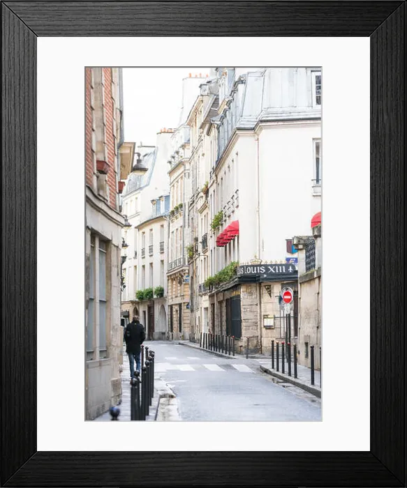 Framed Print : Paris, France - March 2, 2016: Man walking down rue des Grands Augustins in Monnaie on the Left Bank, Paris, France Framed Print : Paris, France - March 2, 2016: Man walking down rue des Grands Augustins in Monnaie on the Left Bank, Paris, France