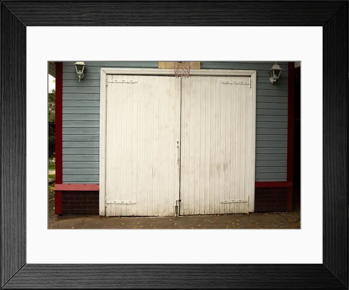 Framed Print : White garage door. Entrance to the house Framed Print : White garage door. Entrance to the house