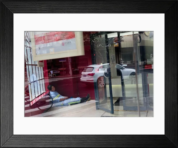 Framed Print : Shangia, China - October 5, 2015: Сhinese worker sleeps in a close office in Wukang Mansion in Shanghai, China Framed Print : Shangia, China - October 5, 2015: Сhinese worker sleeps in a close office in Wukang Mansion in Shanghai, China