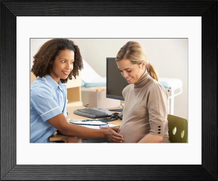 Framed Print : Nurse with pregnant woman patient Framed Print : Nurse with pregnant woman patient