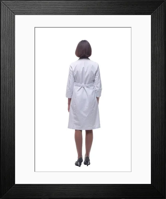 Framed Print : woman doctor is looking intently at the white screen Framed Print : woman doctor is looking intently at the white screen