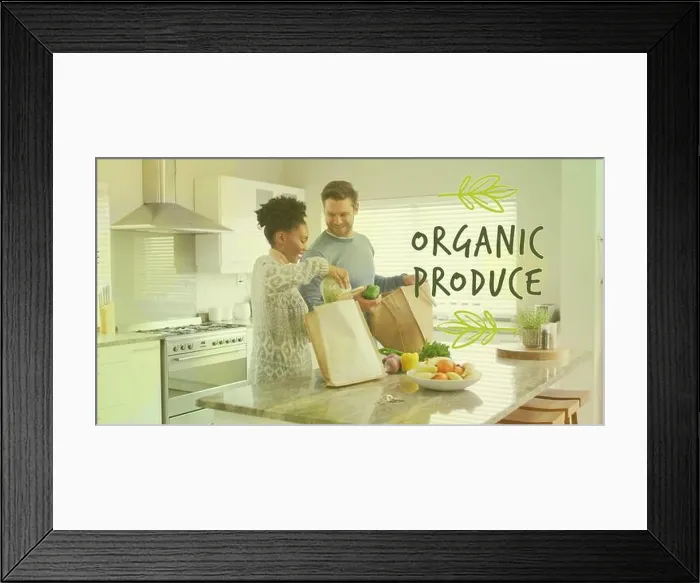 Framed Print : Image of organic produce text over diverse couple preparing healthy meal in kitchen Framed Print : Image of organic produce text over diverse couple preparing healthy meal in kitchen