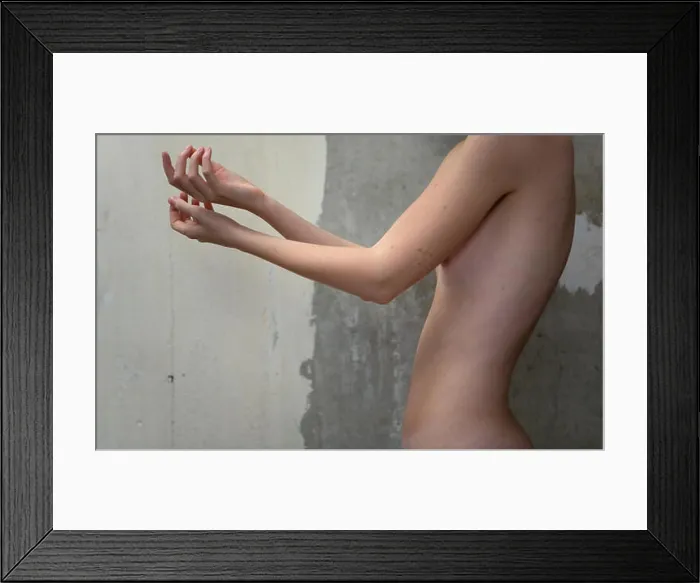 Framed Print : Nude thin girl stretched her arms forward. Female body Framed Print : Nude thin girl stretched her arms forward. Female body