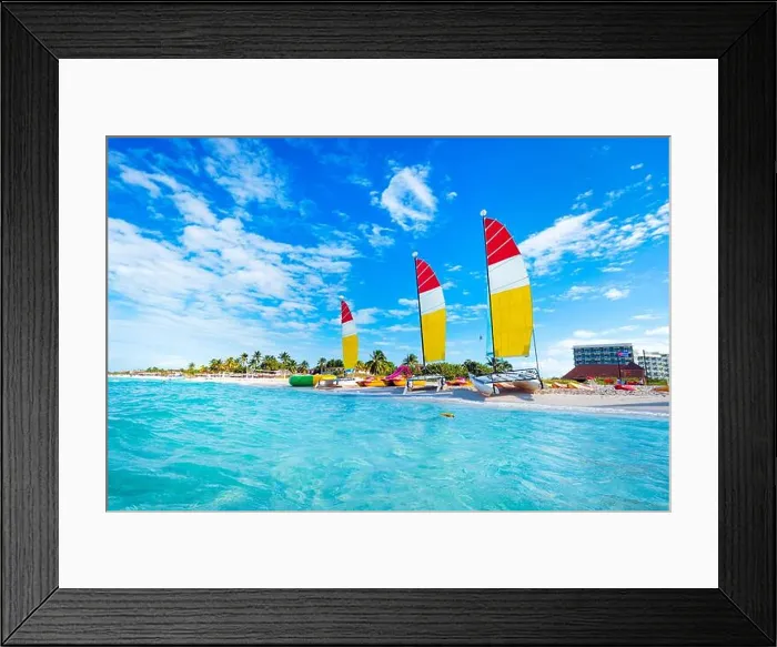 Framed Print : sailing multicolored catamarans is parked on the white sand on the seashore against the backdrop of beautiful tropical Framed Print : sailing multicolored catamarans is parked on the white sand on the seashore against the backdrop of beautiful tropical