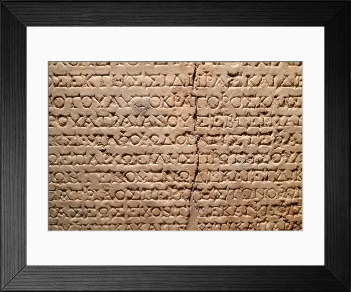 Framed Print : Ancient Greek inscription carved into a stone tablet Framed Print : Ancient Greek inscription carved into a stone tablet