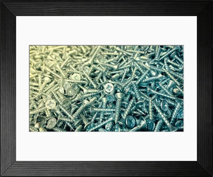 Framed Print : Shiny short self-tapping screws close-up Framed Print : Shiny short self-tapping screws close-up
