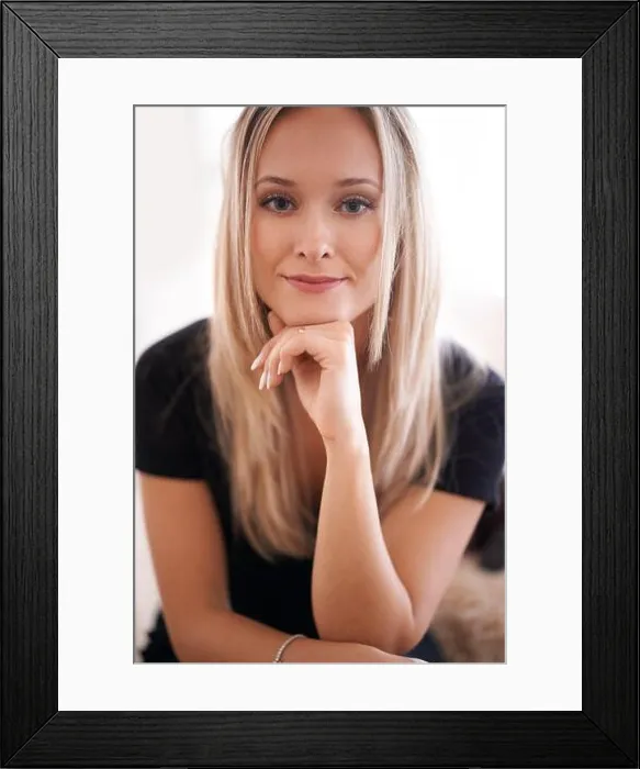 Framed Print : Nothing perturbs me. Portrait of a young woman sitting with her hand on her chin Framed Print : Nothing perturbs me. Portrait of a young woman sitting with her hand on her chin