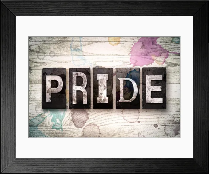 Framed Print : The word 'PRIDE' written in vintage dirty metal letterpress type on a whitewashed wooden background with ink Framed Print : The word 'PRIDE' written in vintage dirty metal letterpress type on a whitewashed wooden background with ink