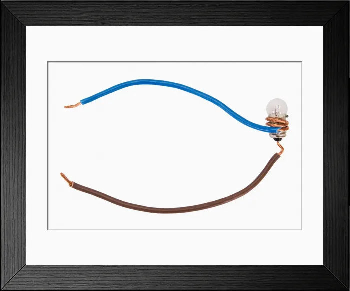 Framed Print : Close-up of wires connected to a light bulb Framed Print : Close-up of wires connected to a light bulb