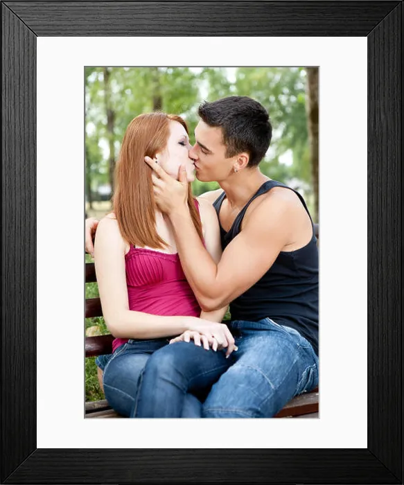 Framed Print : romantic young couple kissing each other