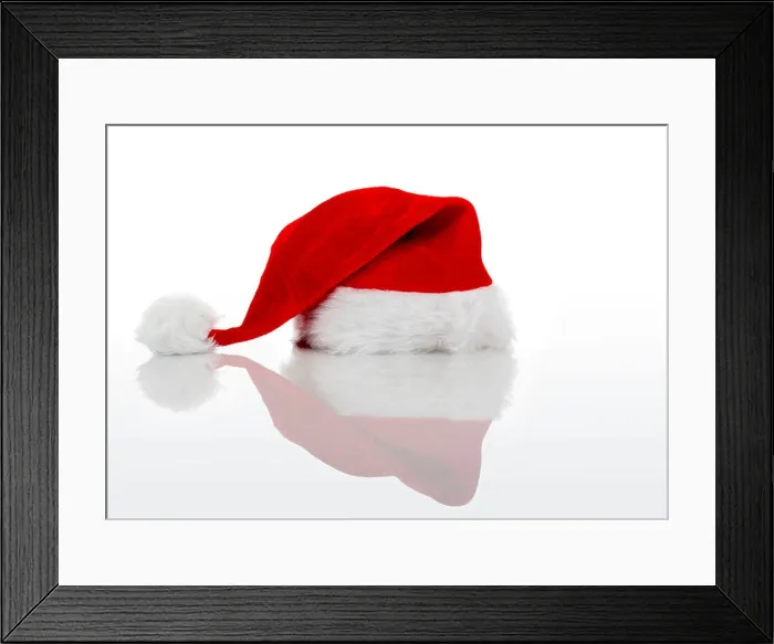Framed Print : A red Santa hat isolated on white background Framed Print : A red Santa hat isolated on white background