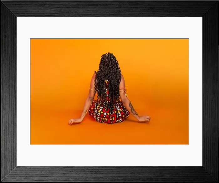 Framed Print : Beautiful young woman with braids in her hair