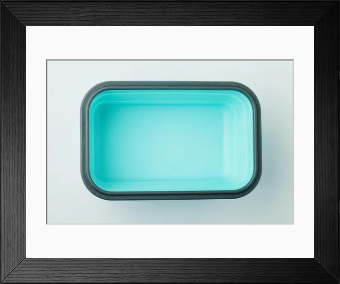 Framed Print : Green empty rectangle plastic container above top view isolated Framed Print : Green empty rectangle plastic container above top view isolated