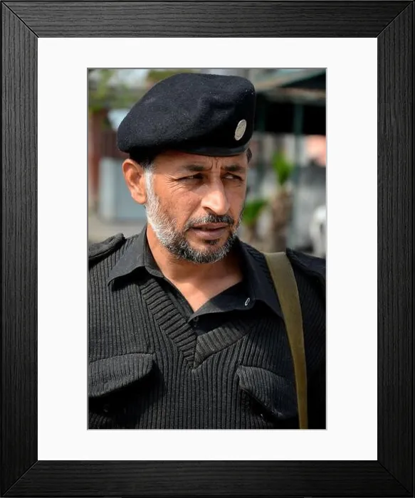 Framed Print : Portrait of Pathan police officer in grey sweater and police hat Peshawar Pakistan