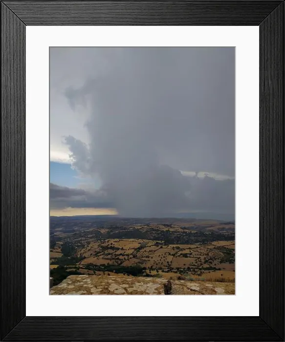 Framed Print : Storm front on the rolling hills: a clash between the forces of nature Framed Print : Storm front on the rolling hills: a clash between the forces of nature
