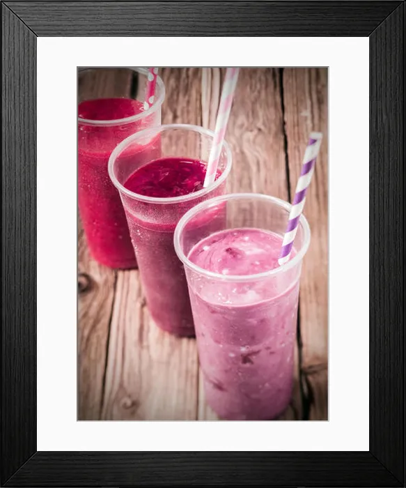 Framed Print : Healthy delicious trio of different berry smoothies with low fat yogurt arranged in a diagonal row