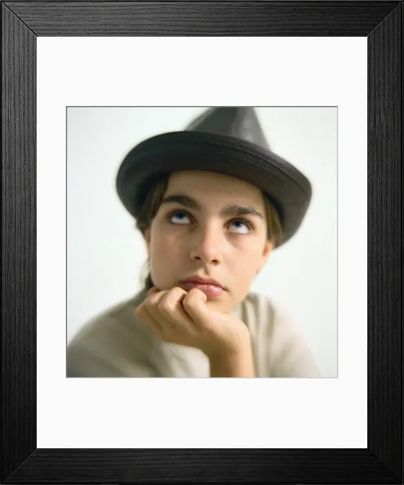 Framed Print : Boy wearing hat, looking up, portrait