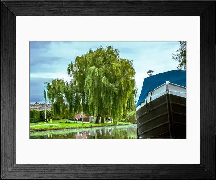 Framed Print : A quiet canal tucked beneath a sweeping willow, where time slows and the water holds the day's soft reflections Framed Print : A quiet canal tucked beneath a sweeping willow, where time slows and the water holds the day's soft reflections