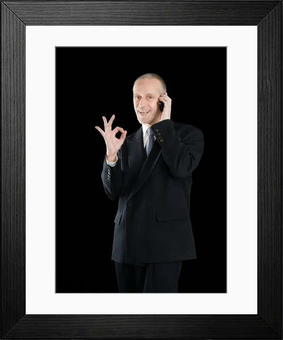 Framed Print : An amiable businessman in black suit Framed Print : An amiable businessman in black suit